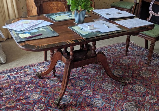 A Regency gonzalo alves banded rosewood breakfast table, W.4ft 3in. D.3ft H.2ft 4in.